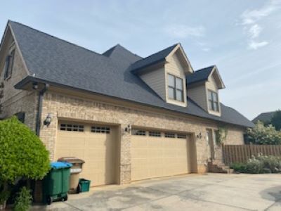 Side View Featuring Two Garage Doors