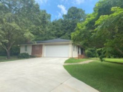View from the driveway of garage on the side of home