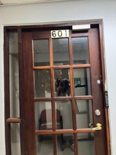 Picture of Glass door to Suite with numbers 601 identifying the Suite