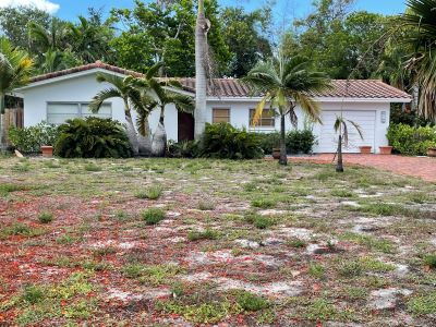 Front of 2054 (1,403 living) sq. ft. Single Family Residence more commonly known as 402 NE 10th Ter., Boca Raton, FL