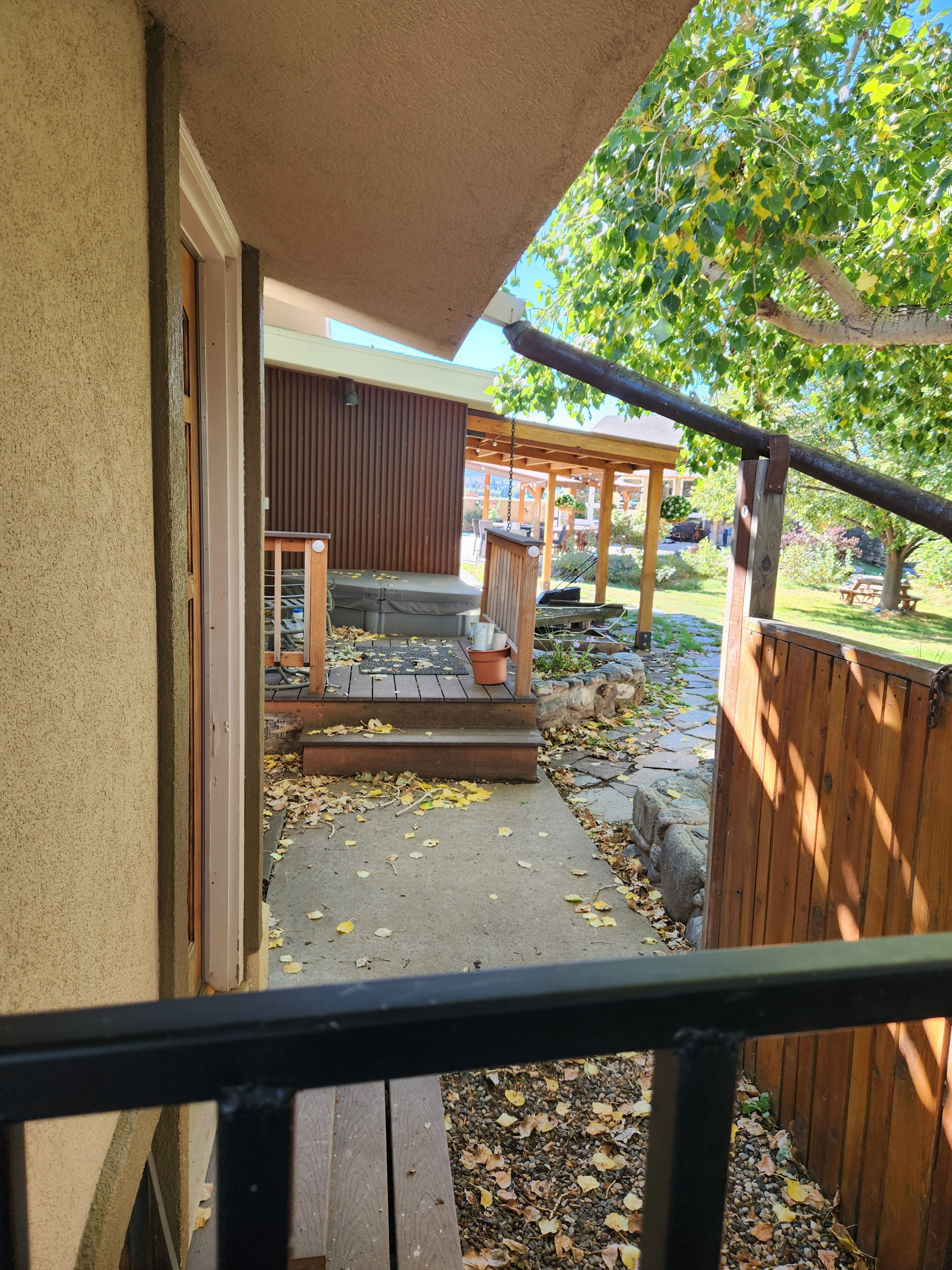 Back yard showing hot tub and part of in ground pool