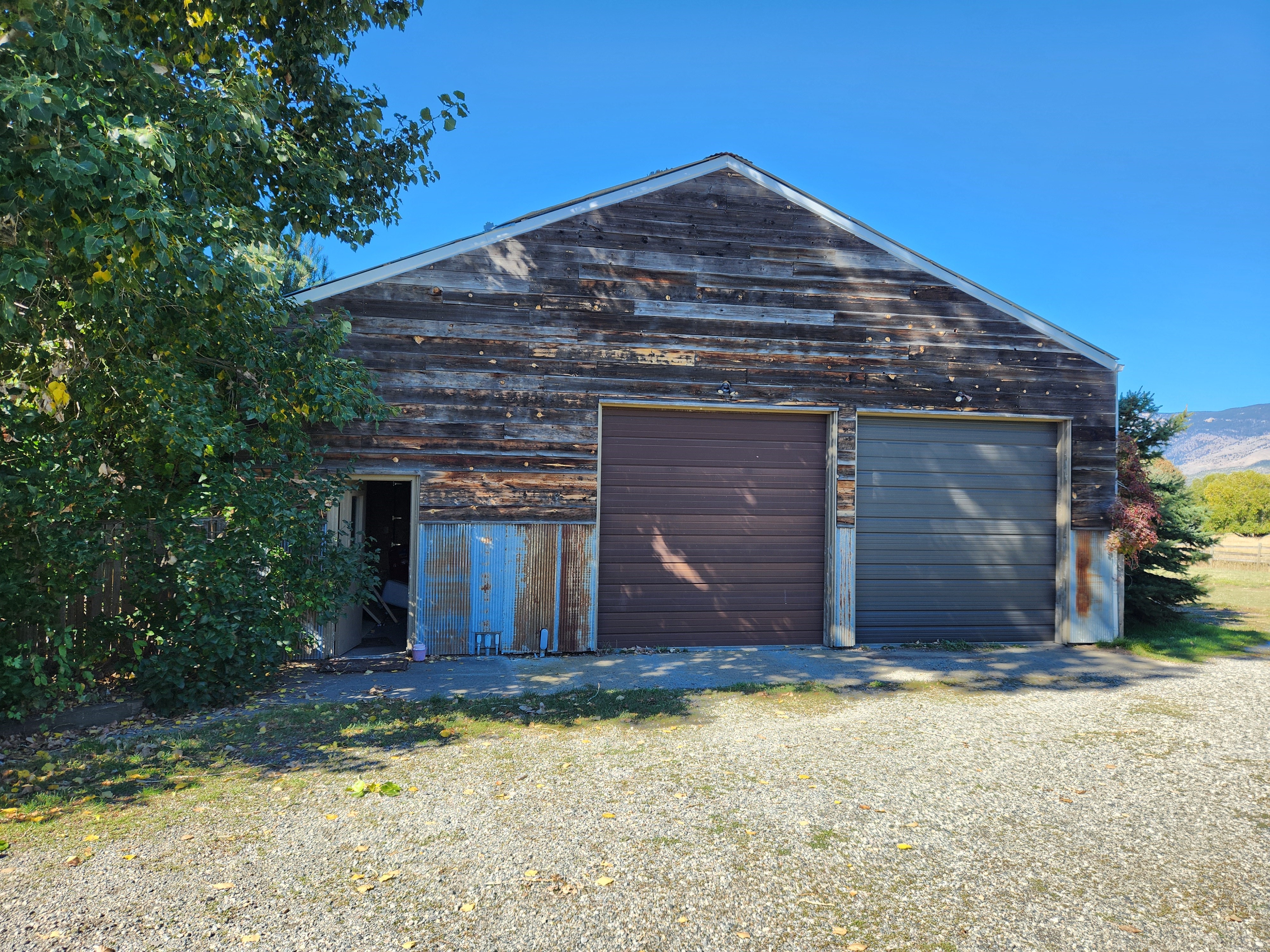 Garage with 2 doors and a side door