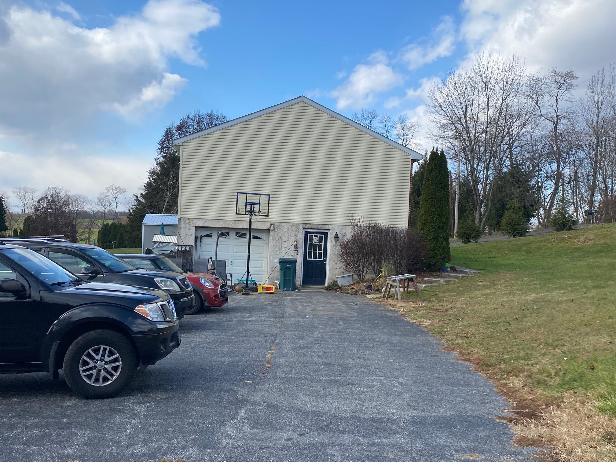 View of side of home showing garage door