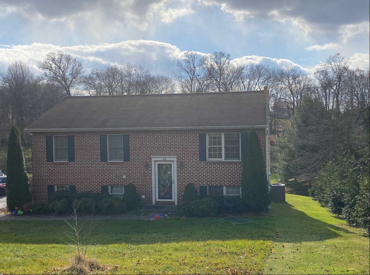 View of the front of 1,120 sq. ft. brick home situated on 2.4 acres more commonly known as 1166 Furniss Rd., Peach Bottom, PA