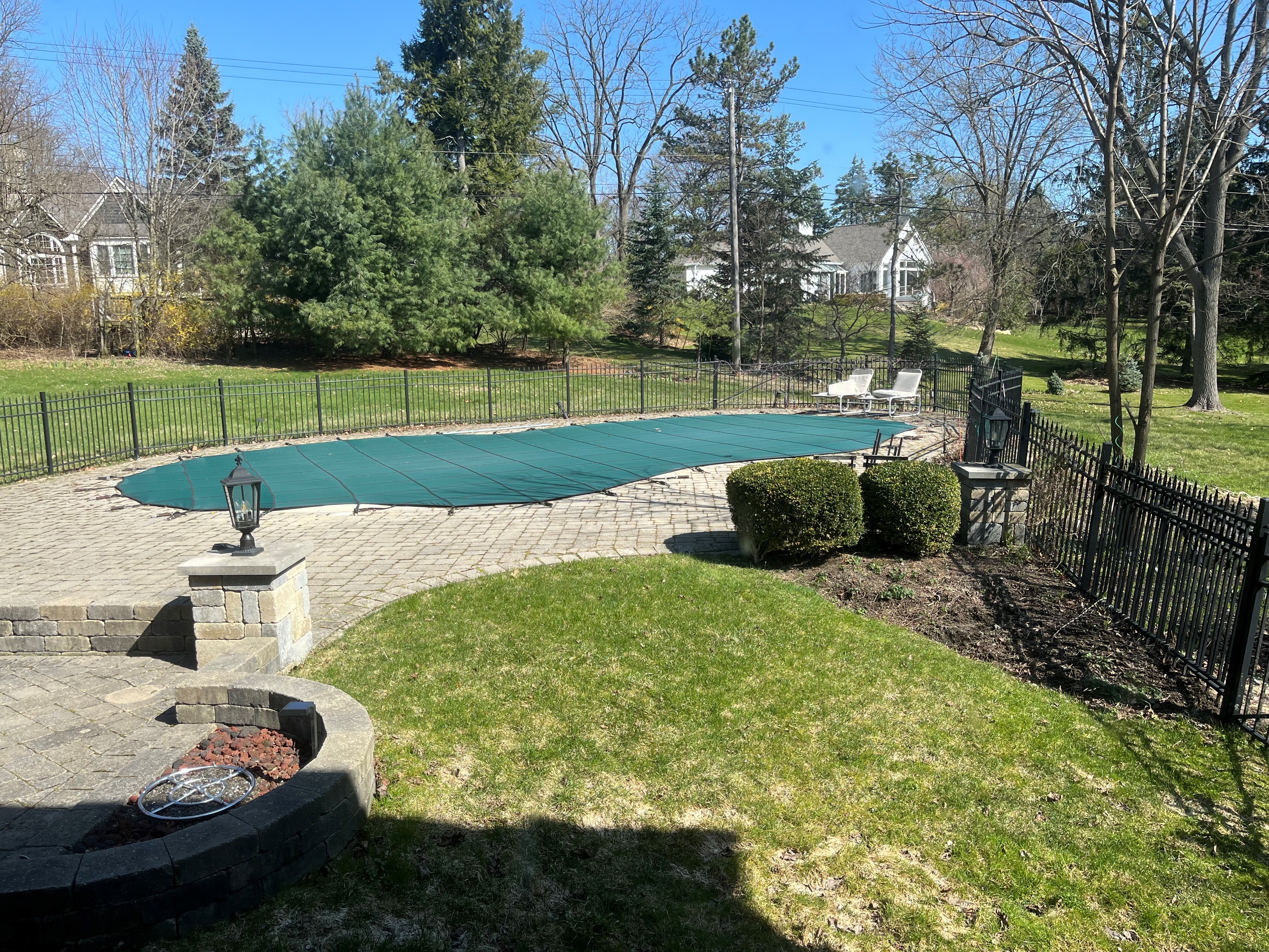 Firepit outside and inground pool fenced in