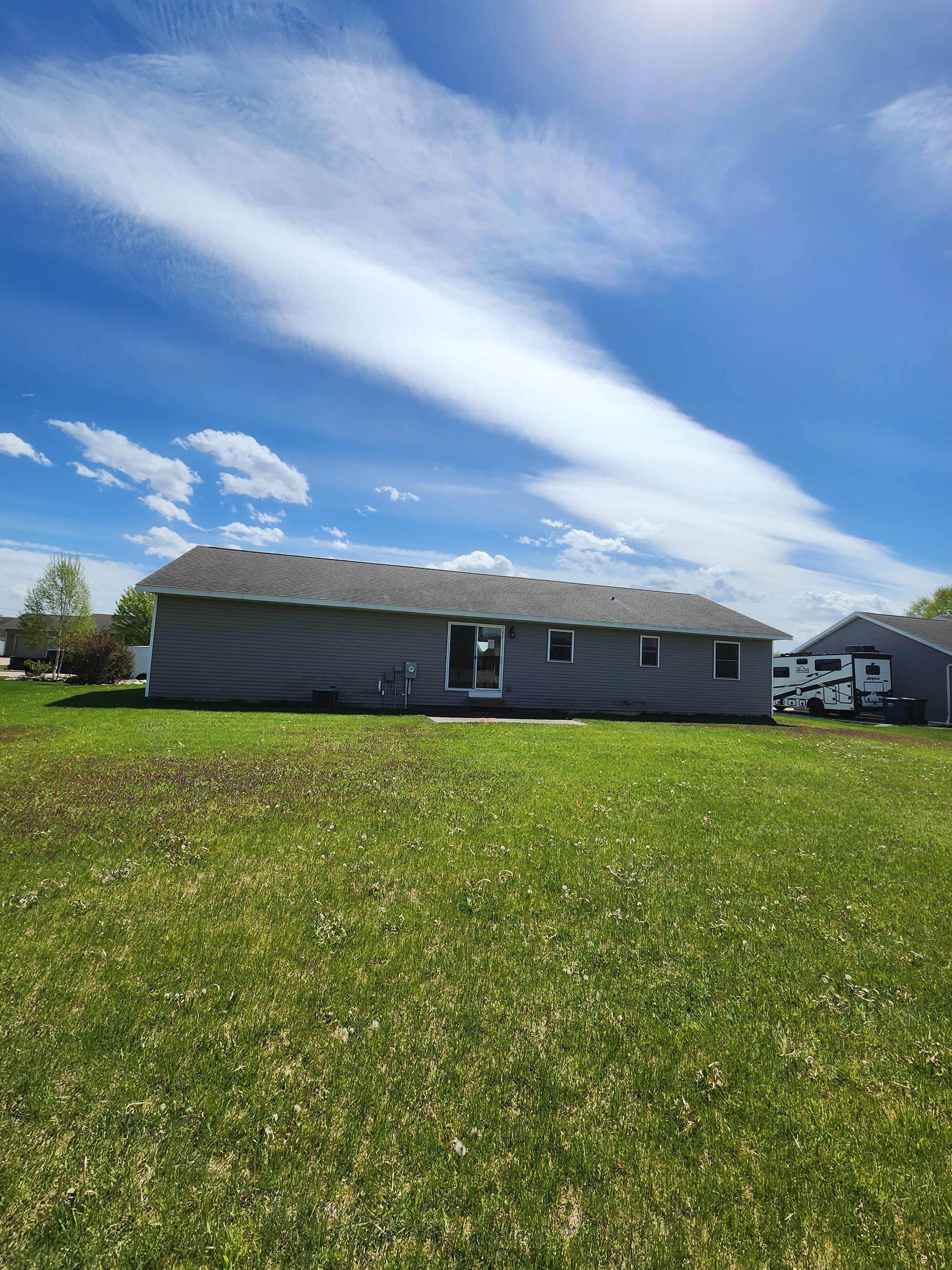 back of house with yard