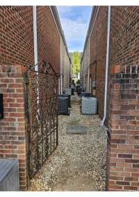 side view of building behind gate