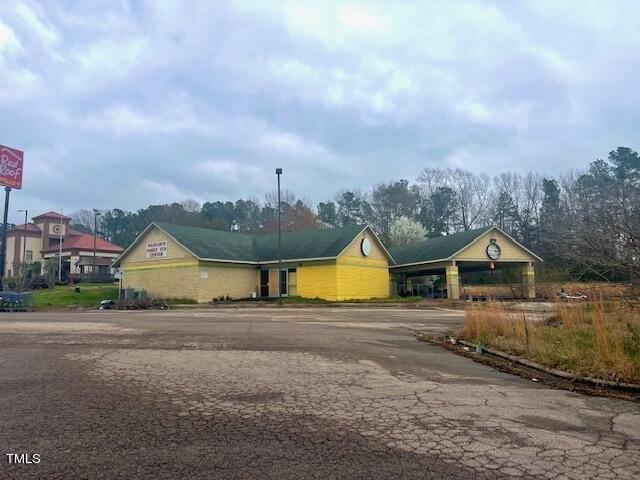 2,180 sq. ft. commercial building, used as an arcade, built in 2004 situated on 1.58 acre more commonly known as 203 N. Cooper Dr., Henderson, NC 27536. Parcel No. 0033A01001.