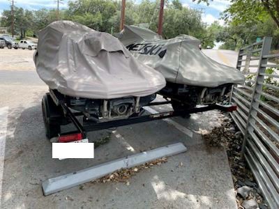Kawasaki Jet skis covered with trailer