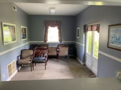 lobby/waiting room with chairs and tables