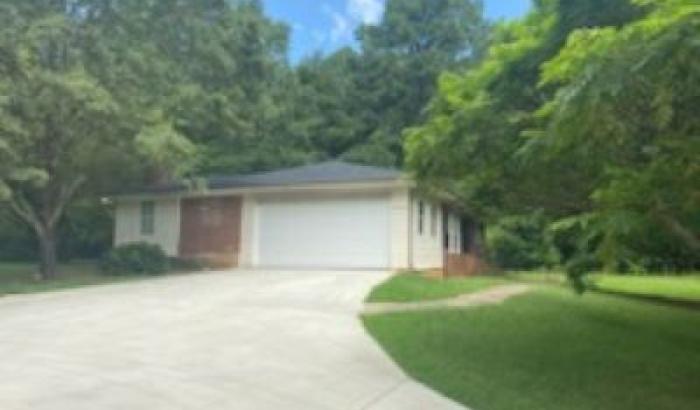 View from the driveway of garage on the side of home