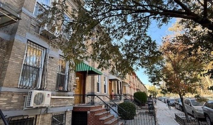 View from street level looking down past the property