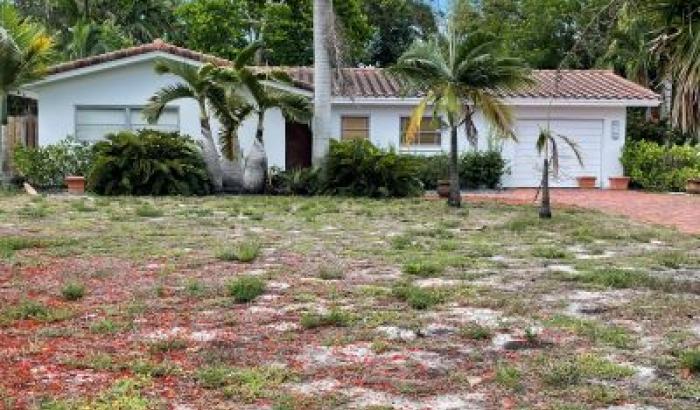 Front of 2054 (1,403 living) sq. ft. Single Family Residence more commonly known as 402 NE 10th Ter., Boca Raton, FL