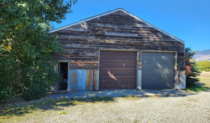 Garage with 2 doors and a side door