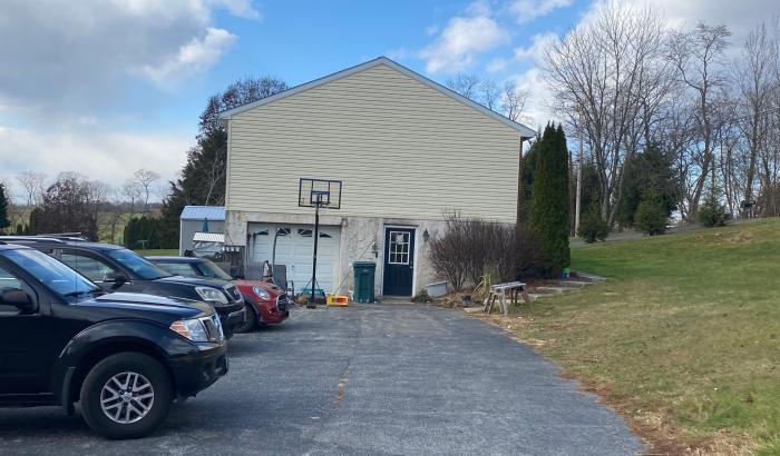 View of side of home showing garage door