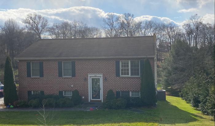 View of the front of 1,120 sq. ft. brick home situated on 2.4 acres more commonly known as 1166 Furniss Rd., Peach Bottom, PA