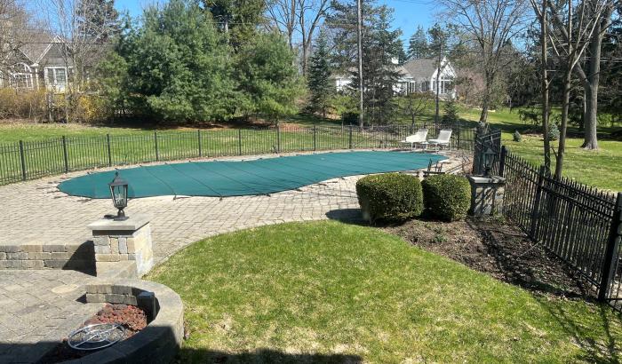 Firepit outside and inground pool fenced in
