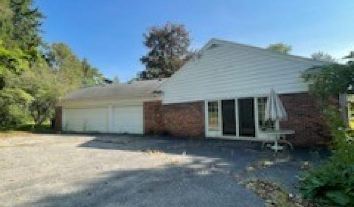 side view of home with 3 car garage