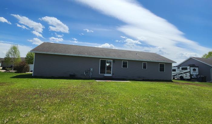 back of house with yard