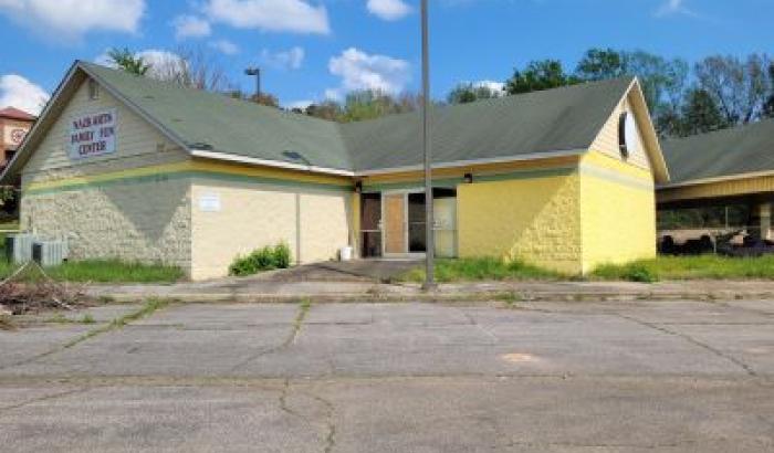 2,180 sq. ft. commercial building, used as an arcade, built in 2004 situated on 1.58 acre more commonly known as 203 N. Cooper Dr., Henderson, NC 27536. Parcel No. 0033A01001