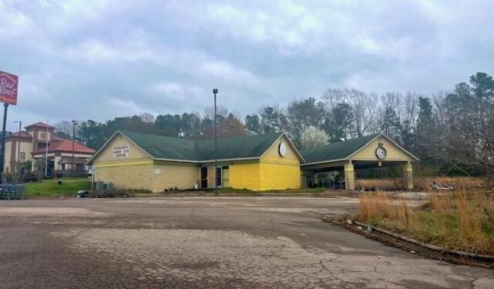 2,180 sq. ft. commercial building, used as an arcade, built in 2004 situated on 1.58 acre more commonly known as 203 N. Cooper Dr., Henderson, NC 27536. Parcel No. 0033A01001.