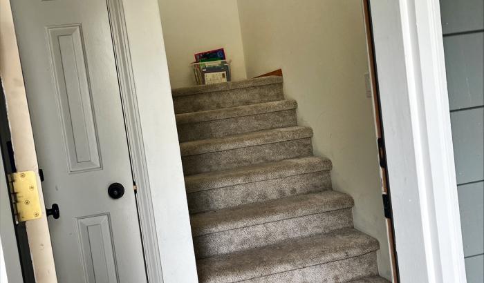 2nd staircase after coming in door next to garage