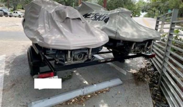 Kawasaki Jet skis covered with trailer